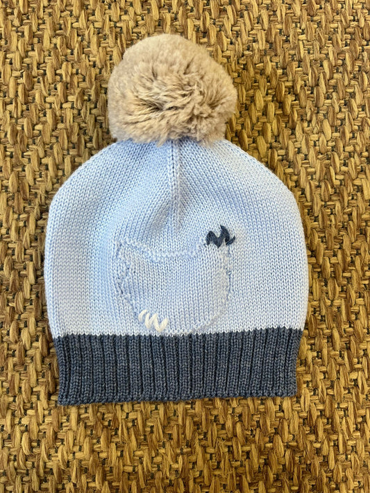 Cappello con pom pom in pelliccia