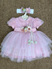 Abito in tulle con cinta di fiori e fascia fiori abbinata